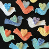 Handmade bird magnets by the potters of Lorraine Oerth & Co.